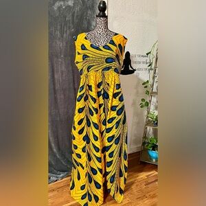 Let’s take a trip in this handmade African print floor length dress.